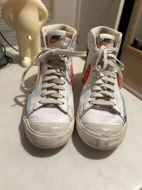 Nike White High-Top Sneakers with Orange and Teal Accents